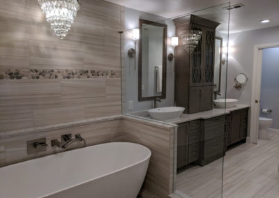 Beautiful remodeled bathroom with chandalier