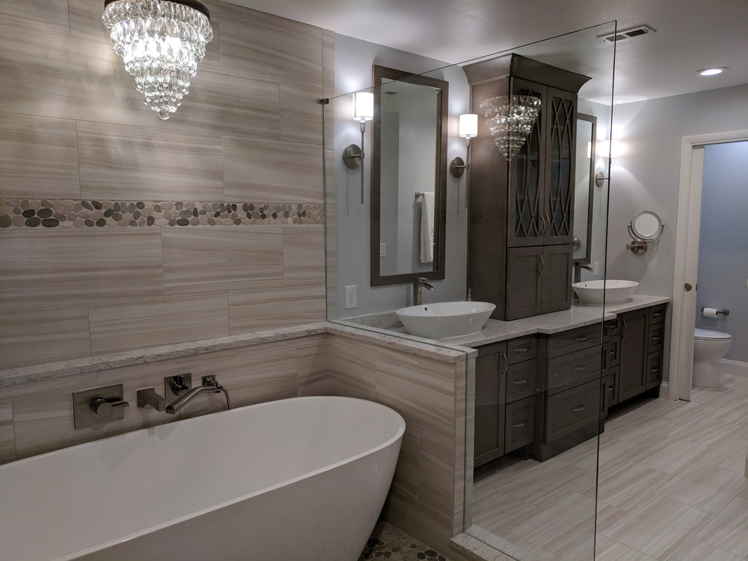 Beautiful remodeled bathroom with chandalier